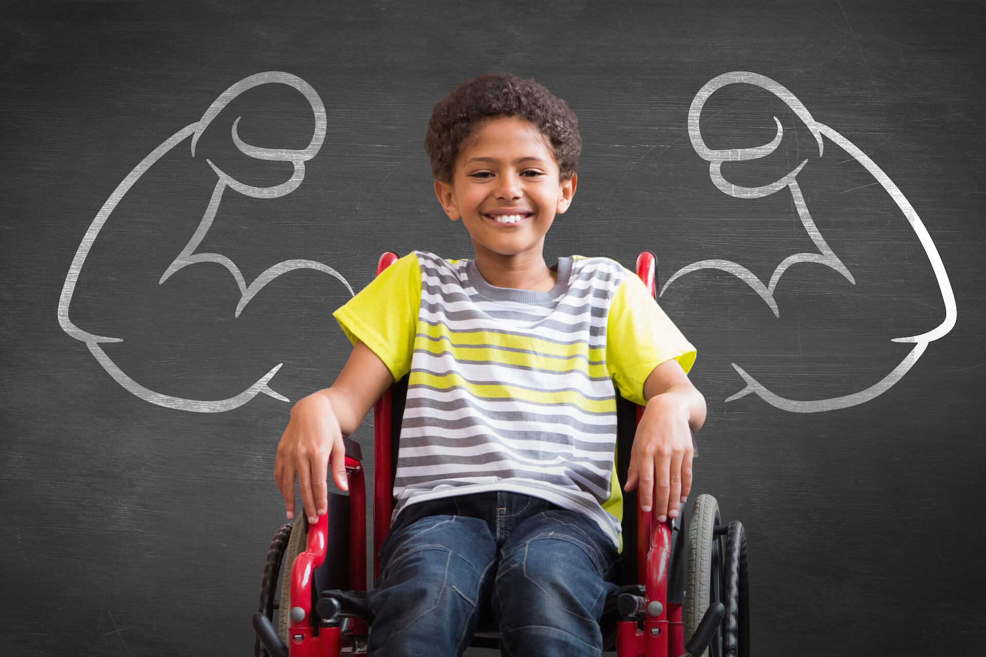 young boy in a wheelchair, smiling